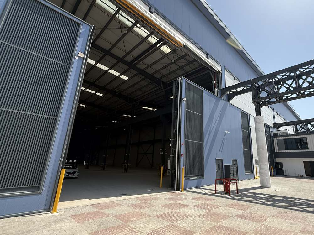 The Steelhaus Abu Dhabi unit seen from the yard, with the roller doors open.